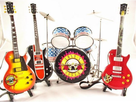 Three guitars and a drumkit