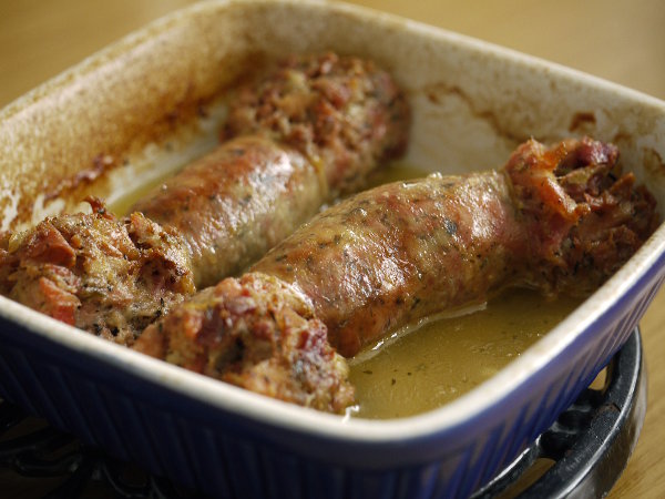 Fatty sausages in a dish